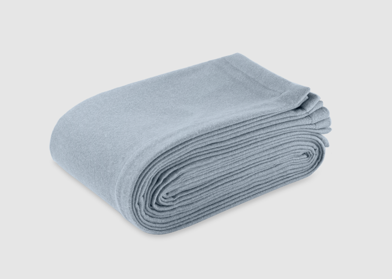Superfine merino wool Cosmo Blanket by Matouk displayed in Forest.